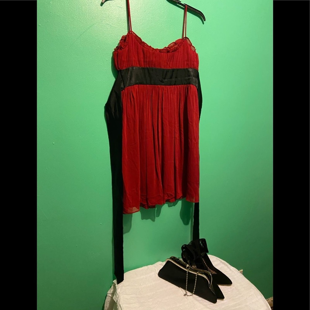 Dark red cocktail dress with black sash.